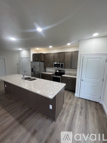 A kitchen with a countertop and cabinets.