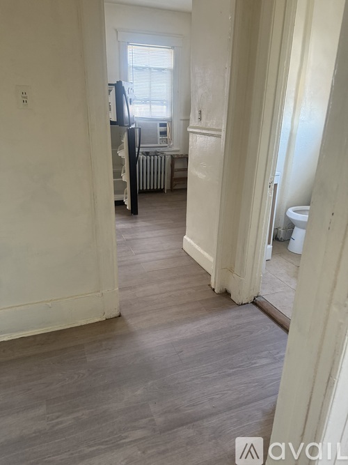 A room with a grey floor and white walls.