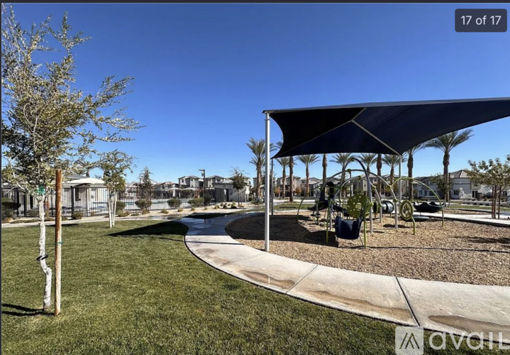 A park with a playground and a pavilion.