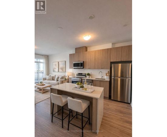 A modern kitchen with a dining table and chairs.