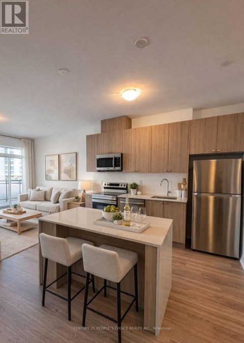 A modern kitchen with a dining table and chairs.