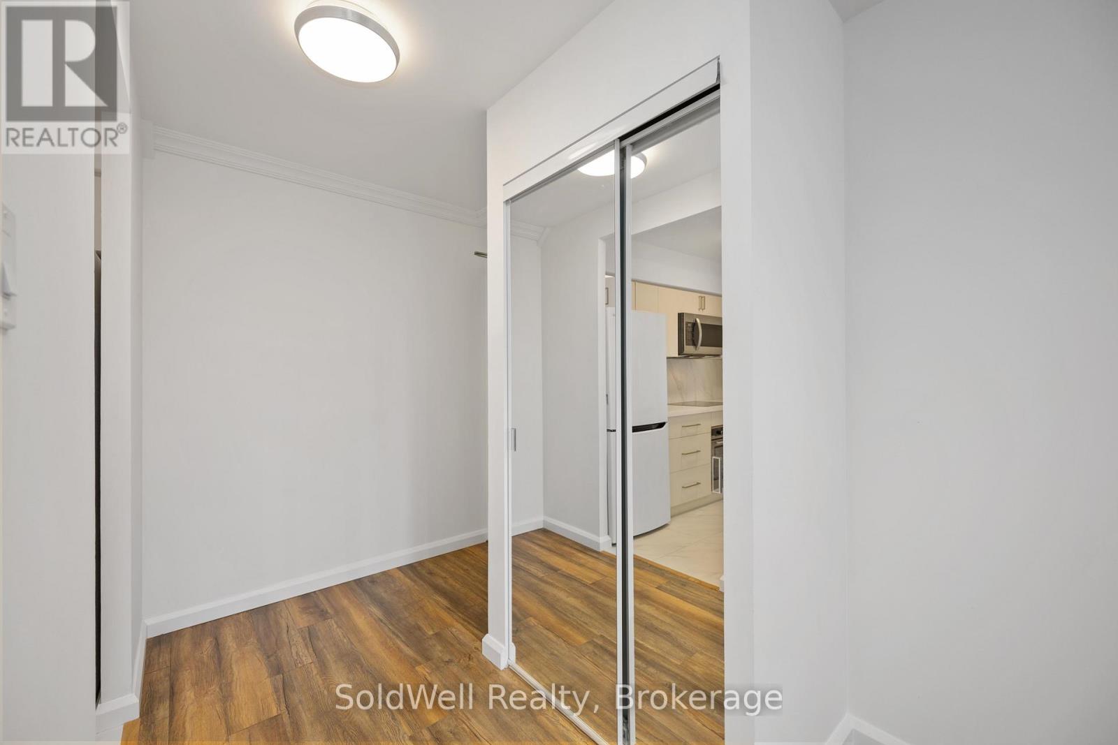 A room with a sliding door leading to another room.