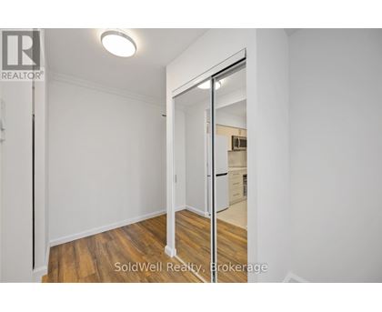 A room with a sliding door leading to another room.