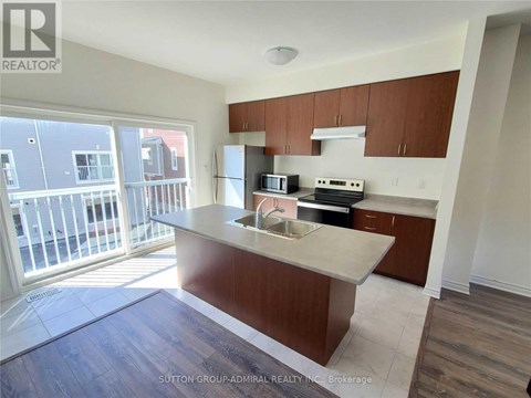 A kitchen with brown cabinets and a white countertop.