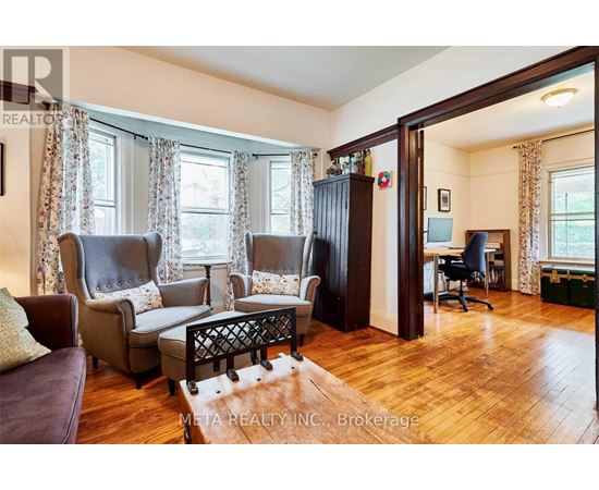 A living room with a brown leather chair and a wooden coffee table.