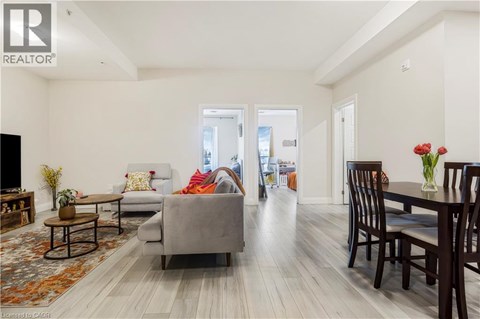 A living room with a grey couch and a wooden coffee table.