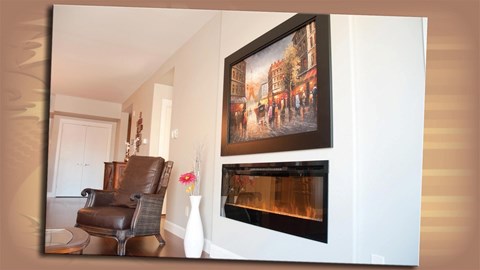 A painting of a street scene hangs above a fireplace in a living room.