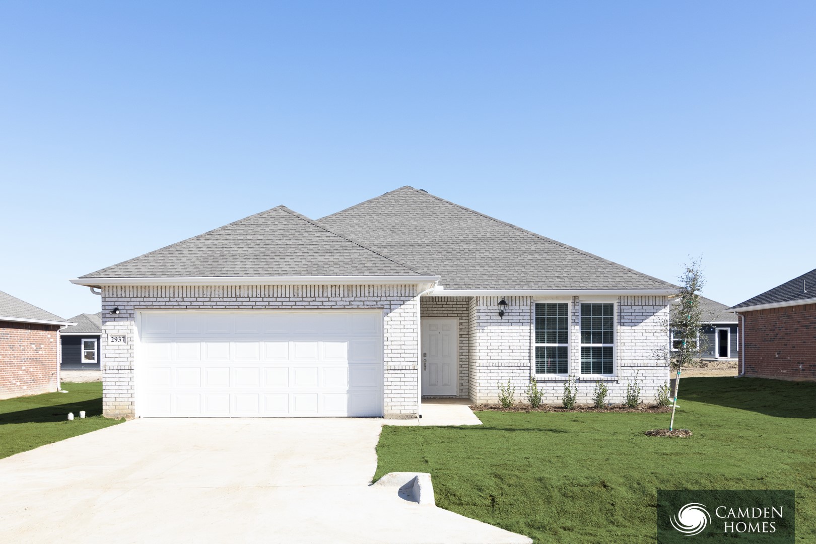 A house with a Camden Homes logo in the corner.