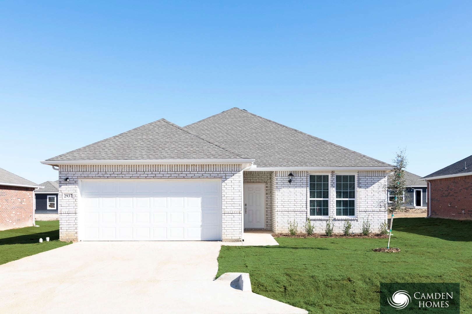 A house with a Camden Homes logo in the corner.