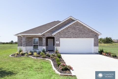 A house with a Camden Homes logo in the corner.