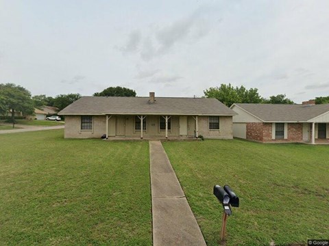 A house with a mailbox in front of it.