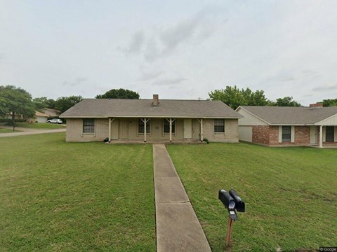 A house with a mailbox in front of it.