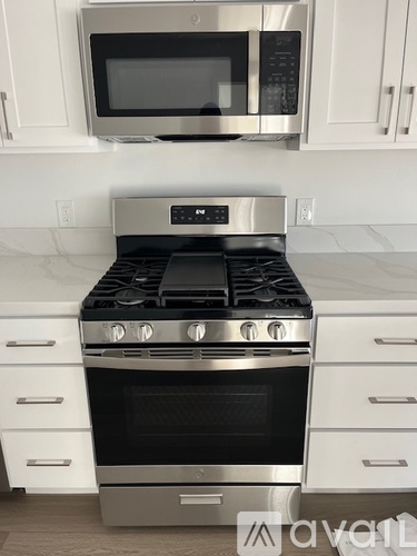 A stainless steel oven with a microwave above it.