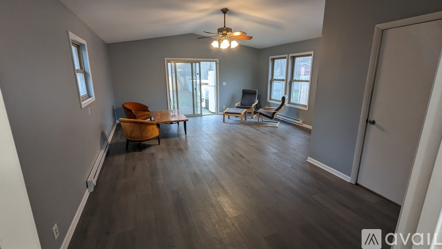 A living room with a brown chair and a brown table.