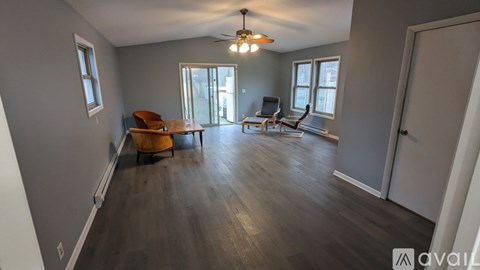 A living room with a brown chair and a brown table.