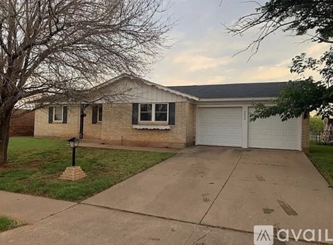 A house with a driveway in front of it.