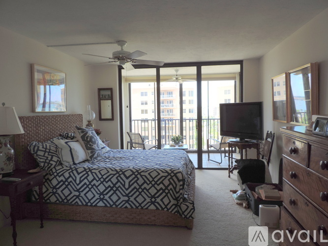 A bedroom with a large bed and a television.