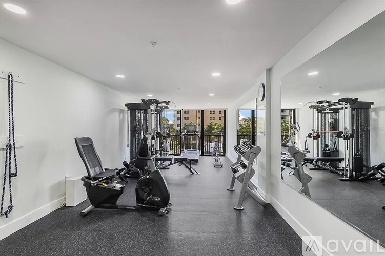 A spacious home gym with various exercise equipment.