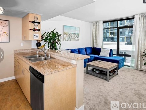 A kitchen with a sink and a dishwasher.