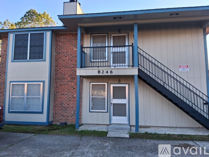 A two-story building with the number 8246 on the front.