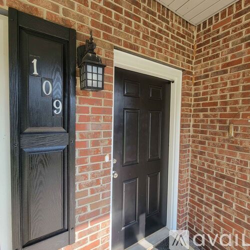 A black door with the number 109 on it.