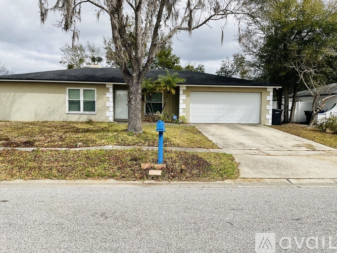 A house with a blue post in front of it.