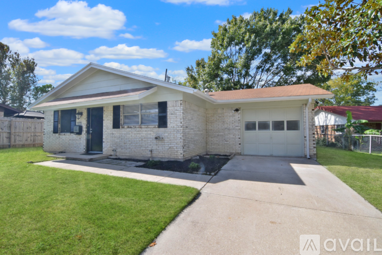 A house with a white garage door is for sale.