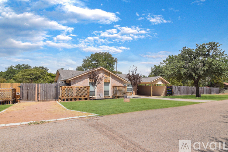A house with a driveway in front of it is for sale.