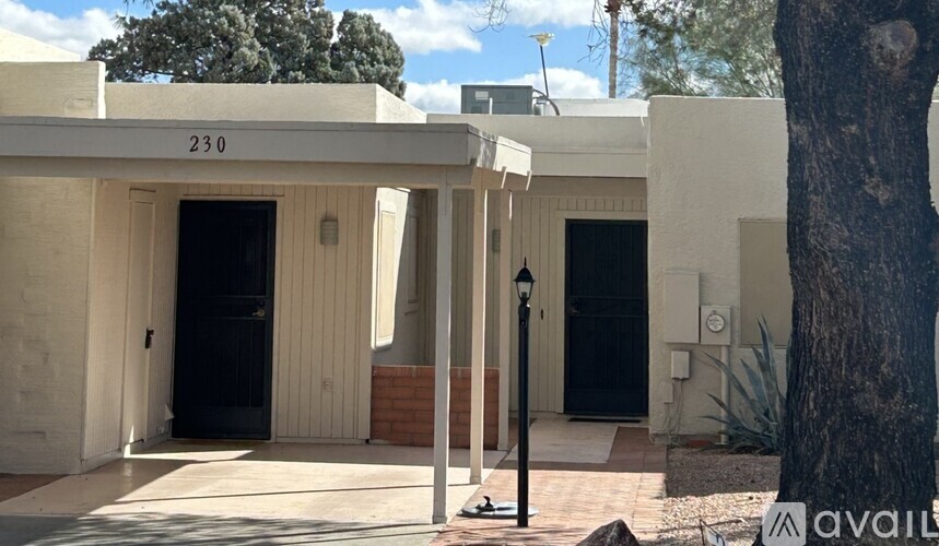 A white building with the number 230 on it.