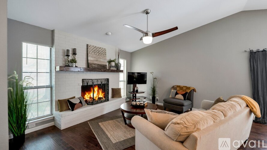 A living room with a fireplace and a couch.