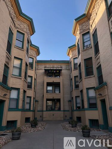 A building with a green trim around the windows and doors.