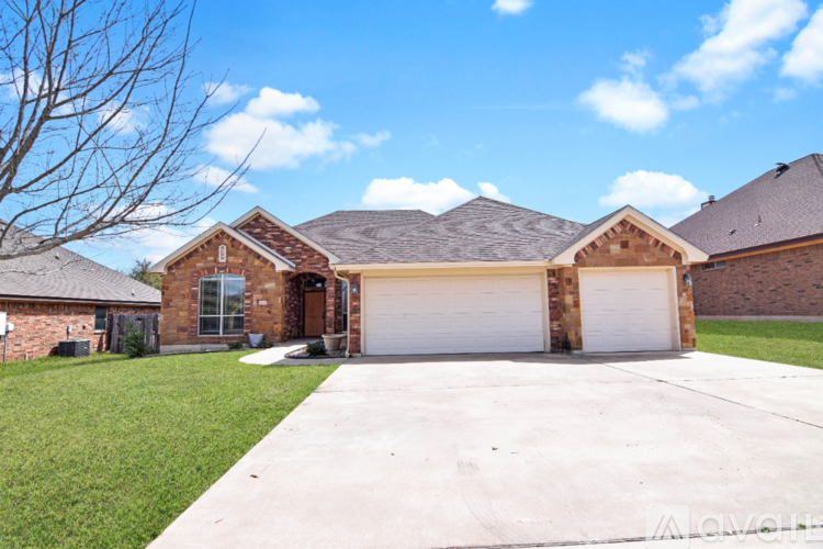 A house with a white garage door in front.