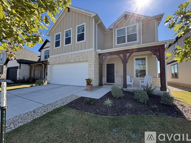 A house with a garage and a covered patio is for sale.