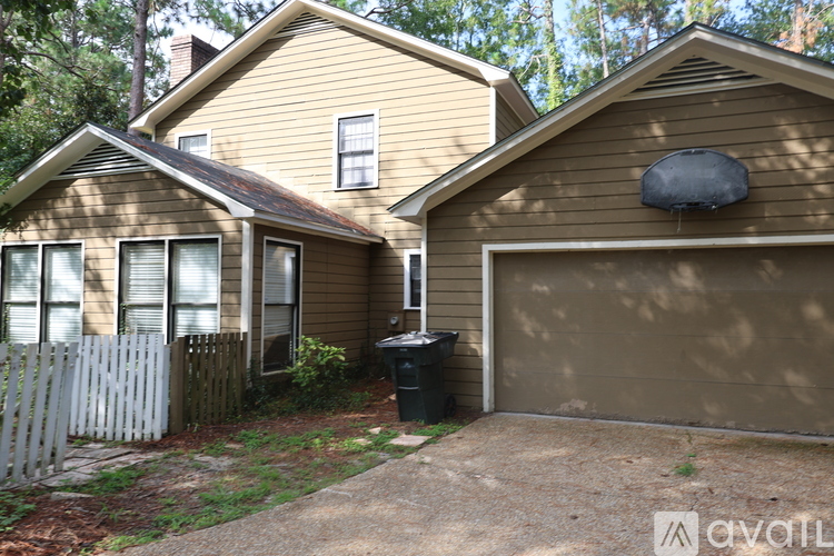 A house with a garage and a driveway.