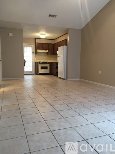A kitchen with white appliances and a white refrigerator.