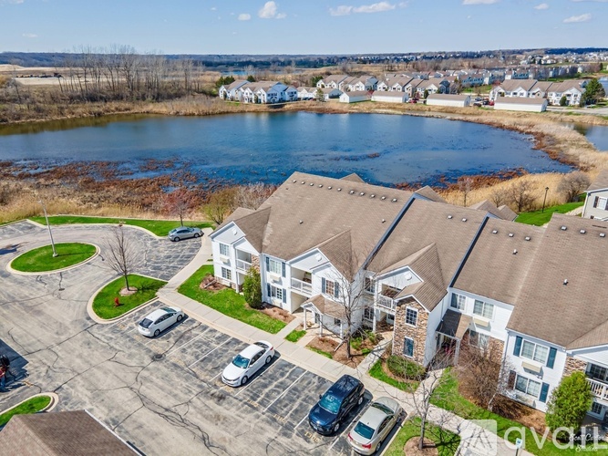 A bird's eye view of a residential area with houses and cars.