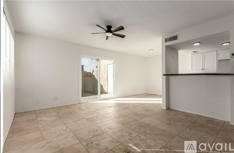 A room with a ceiling fan and tiled flooring is available for rent.