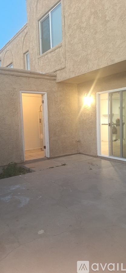 A house with a beige exterior and a white door is shown.