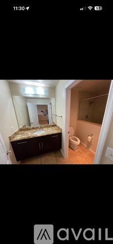 A bedroom with a bed and a toilet in it.
