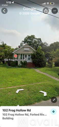A small building with a red marker on it is located at 102 Frog Hollow Rd.