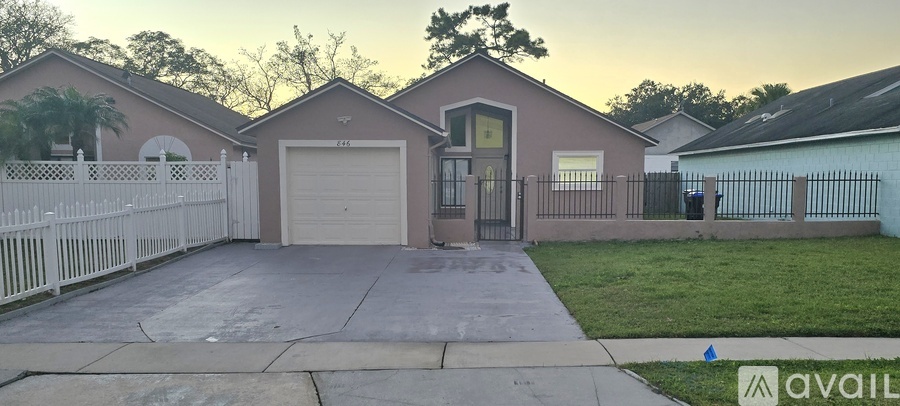 A house with a garage is for sale.