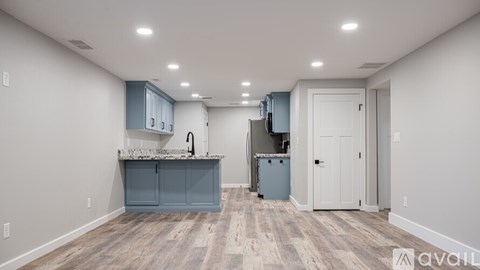 A kitchen area with a counter and cabinets.