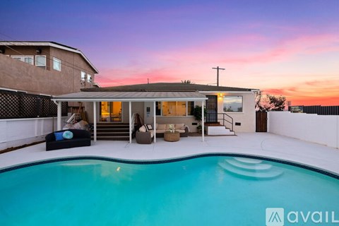 A house with a pool in the backyard is available for rent.