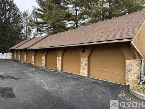 A row of garage doors in front of a building.