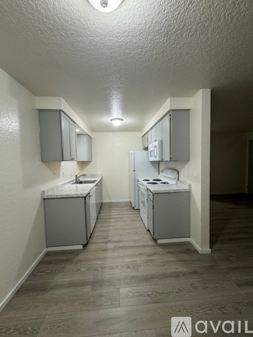 A bathroom with two sinks and two mirrors.
