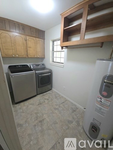 A kitchen with a stove top oven and a dishwasher.
