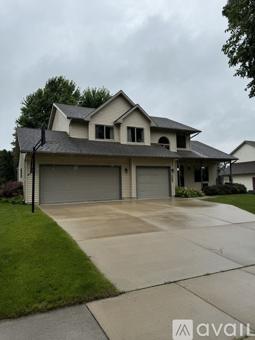 A two-story house with a garage is shown.