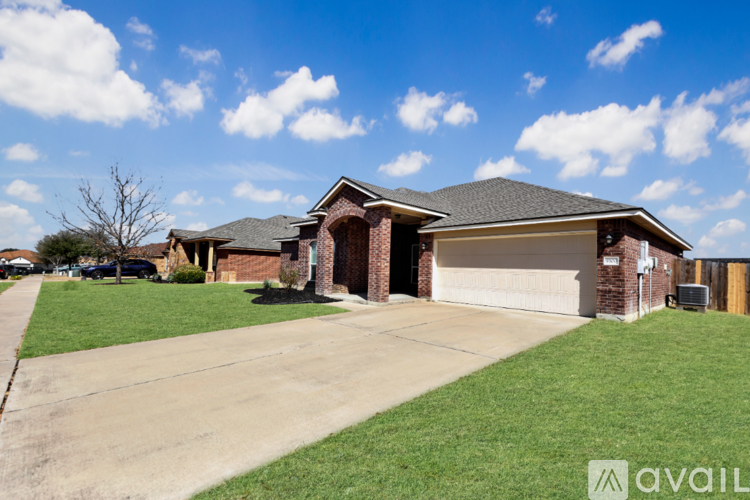 A house with a garage is available for sale.