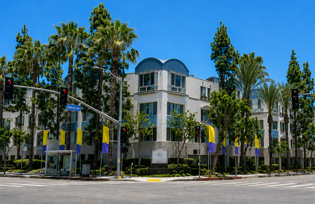 A building with a blue dome and palm trees in front.