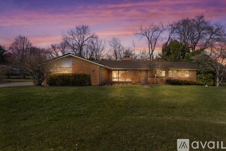 A house with a lawn in front of it is available for sale.